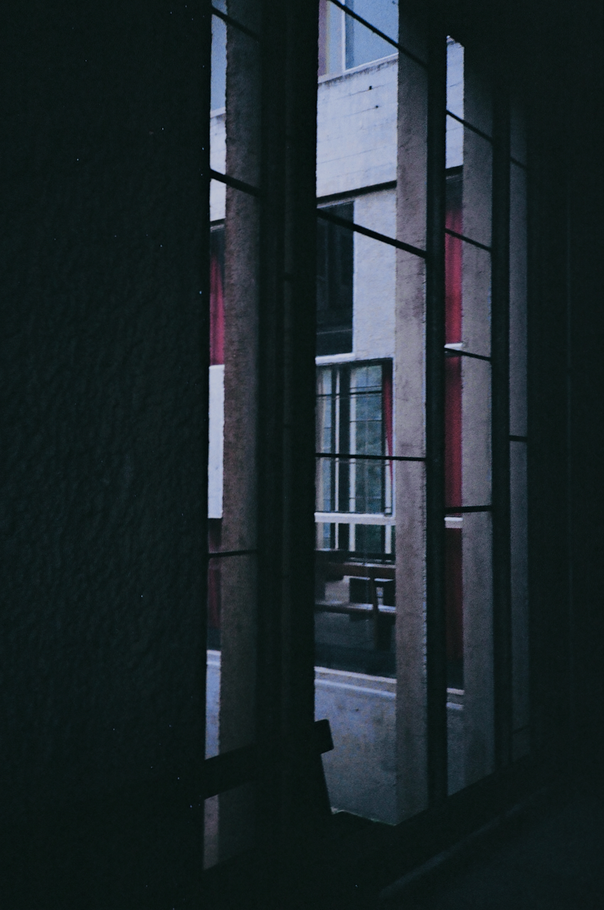 A window with vertical blinds, seen from outside