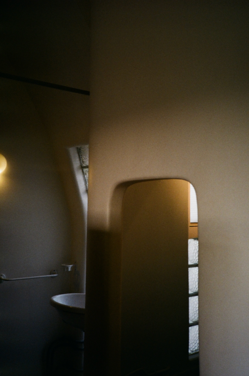 An interior view of a bathroom with a sink and a window